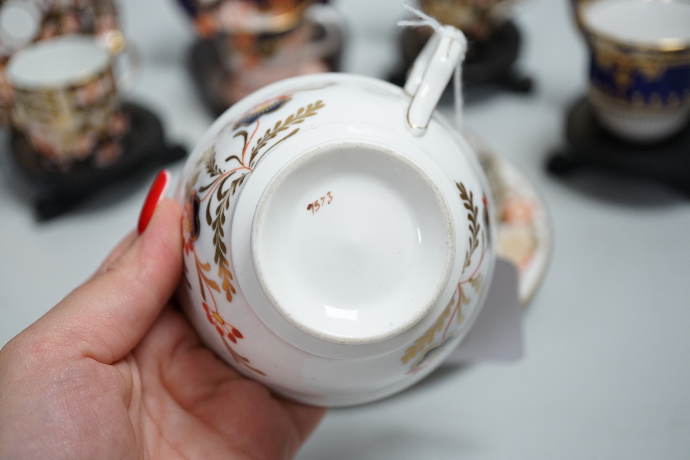 Three pairs of Royal Crown Derby porcelain cups and saucers, another Spode and a Victorian trio